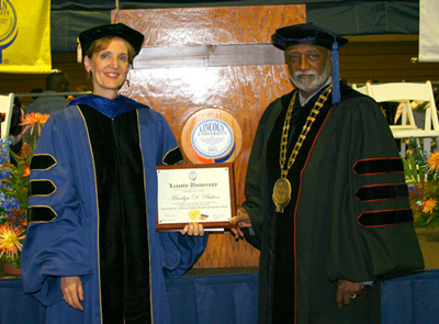 Dr. Marilyn Button receives award from Lincoln President Ivory V. Nelson