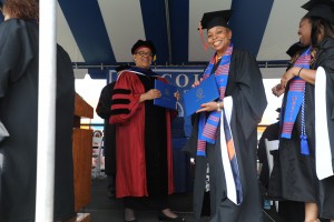 Acting President Valerie I. Harrison, J.D., Ph.D., with Camden, New Jersey Mayor Dana Redd ’15, MHSA as she receives her degree.