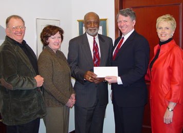 Lincoln University President Ivory V. Nelson, Ph.D. (center), is presented with the commitment of $1 million from the Board of Directors of the Oxford Foundation to renovate the University's Ware Fine Arts Center, Theatre and Studio.