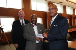 Thompson Hospitality Chief Administrative Officer Fred Thompson (right) and Senior Vice President, Business Development Shawn O’Quinn (left), presented Lincoln University President Robert R. Jennings (center) with a check for $25,000